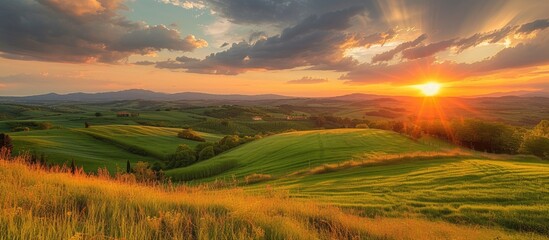 The sun gradually sets over the picturesque rolling hills, creating a captivating and serene beauty.