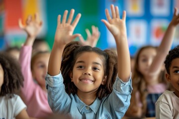 Fototapeta premium Smiling girl raises hands in classroom