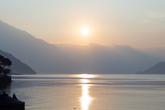 Italia. Sunset on Como Lake with mountains. Bellaggio