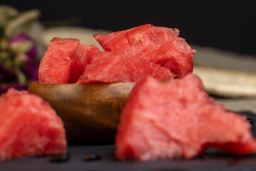 sliced into pieces of red ripe watermelon