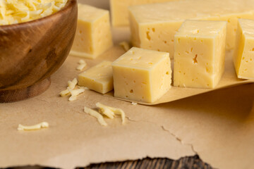 yellow semi-hard cheese with holes