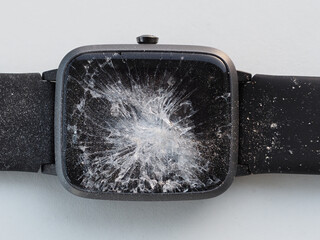 Top view of Smart watch with cracked screen. Close-up.