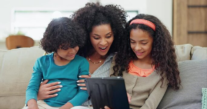 Mother, children and tablet for home education, e learning and online games on sofa with wow for news or movie. Happy interracial family and kids on digital technology, internet or streaming surprise