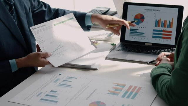 Atmosphere of a startup company meeting, business people are meeting together to summarize and plan investment finances, they are the founders of the company. Business administration concept.