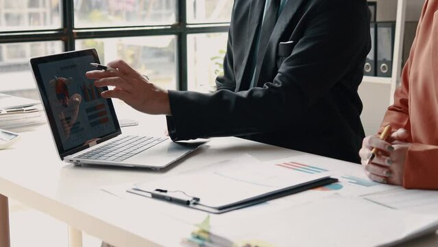 Atmosphere of a startup company meeting, business people are meeting together to summarize and plan investment finances, they are the founders of the company. Business administration concept.