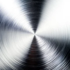 Foto op Canvas A close-up shot of a metallic surface with a radial brushed finish creating a vortex illusion. © Margo_Alexa