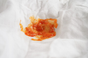 Dirty tomato sauce stain or ketchup on cloth to wash with washing powder, cleaning housework...