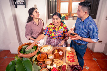 Mayan family enjoys the moment during the preparation of the tamales.