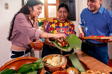 Latin family prepares food for a holiday.