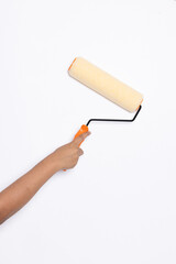 Decorator's hand painting wall with roller