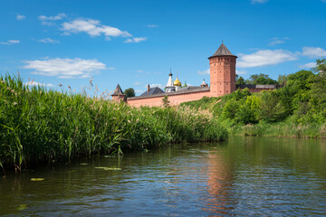 Fototapeta na wymiar View of the Spaso-Evfimiev Monastery (a monastery of the Vladimir Diocese of the Russian Orthodox Church) on the bank of the Kamenka River on a sunny summer day, Suzdal, Vladimir region, Russia