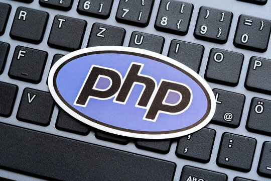 PHP programming language logo symbol on a modern desktop PC computer keyboard, website development, web apps and server side software, php programmers career concept