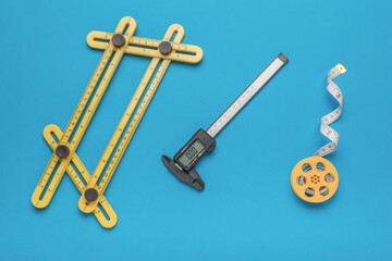 A set of measuring instruments on a blue background.