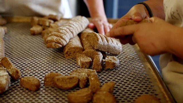 close up of hands making handmade rusks, production line of handmade pastries