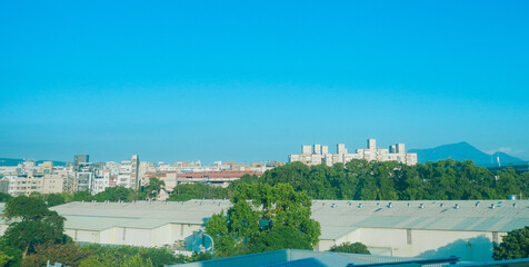 Obraz premium Taipei, Taiwan, Republic of China, 01 19 2024: New Taipei city (in Republic of China, Taiwan) landscape and mountain seen from high speed train