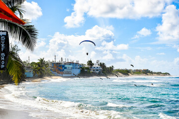 Jobos beach with paraglider near the town of Isabela on the island of Puerto Rico in the Caribbean. 