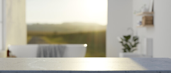 A white tabletop with empty space with a blurred background of a luxury bathroom with bathtub.