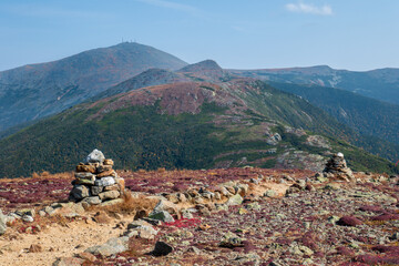 rock cairns mark the Appalachian trail in the White Mountains of NH Mount Washington in background © bearle