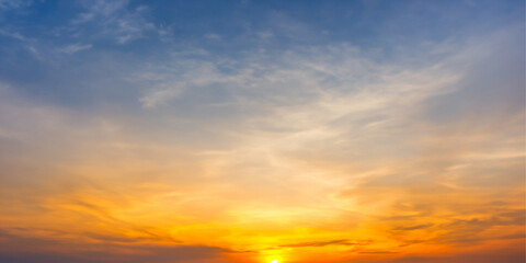 Vivid Evening Sky: A breathtaking blend of sunset hues, with vibrant clouds painting the sky in...