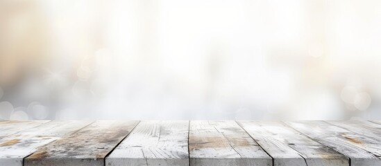 A grey wooden table sits empty against a blurred cityscape background. The composite material flooring adds contrast to the natural wood. Perfect for still life photography or cooking inspiration