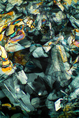 Abstract micrograph of methionine crystals made with a polarizing microscope.