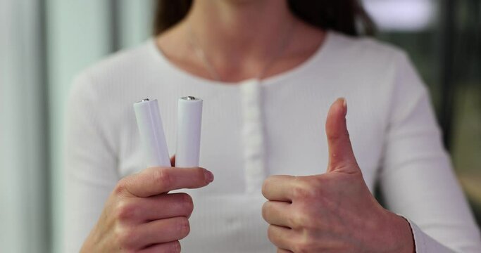 White AA batteries thumbs up