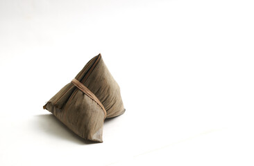 Zongzi, the traditional sticky rice dumpling for the Chinese Dragon Boat Festival, isolated on a white background.