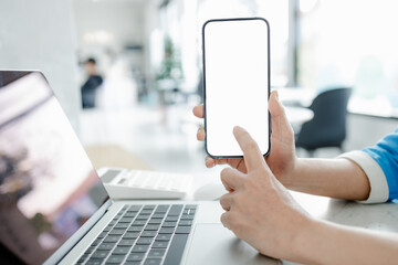 Woman holding smart phone with blank copy space screen for your text message or your content