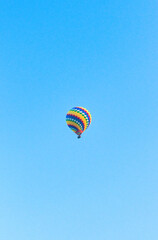 19022024 Colorful hot air balloons fly over the Vang vieng city, Laos in Asia. This was during sunrise on a clear hot day during dry season.