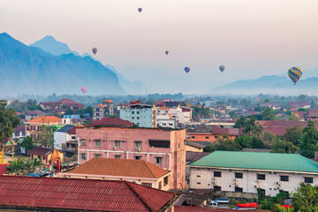 19022024 Colorful hot air balloons fly over the Vang vieng city, Laos in Asia. This was during...