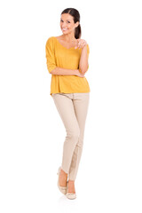 Woman, fashion and portrait for elegance, point and smile in outfit in studio for minimalist style. Female person, happy and yellow top by white background, proud and confident in attractive apparel