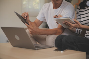 Asian business people discussing team of young asian entrepreneurs discussing business, Asia business team meeting discussion talking.