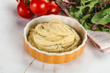 Creamy hummus in the bowl