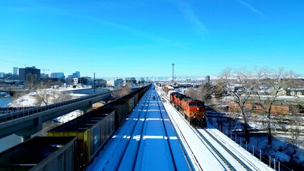 Close up of railroad tracks with freight train stopped on the siding