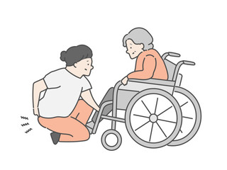 腰を痛めた女性介護士と車椅子に乗った高齢女性
