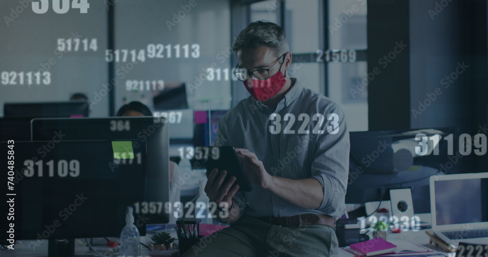Poster image of financial data processing over businessman with face mask using tablet in office