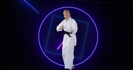 Image of purple neon scanner processing data over female martial artist