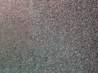 Stones textured fence gabion steel metal grate stone wall basket made of mesh and stones background stone and gravel enclosed in metal cage to create wall and facade. Steel mesh barrier gravel stone.