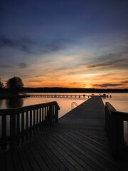 Sunset on the pier. Olsztyn. Lake Ukiel