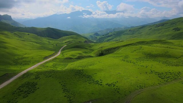 Actoprak's green mountain pass aerial view day's charm cloud embrace majestic Mountain pass scenic wonder rejuvenating retreat captivating. Mountain pass aesthetic joy pristine wilds untouched.