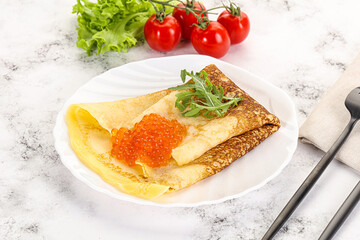 Russian pancake with red caviar