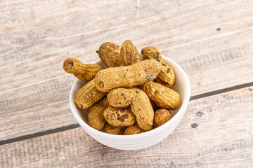 Raw ripe unpeeled peanut heap