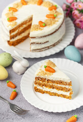 Homemade Easter carrot cake made with walnuts, iced with cream cheese. Sweet dessert.