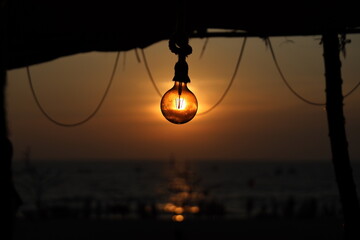 hanging on a swing at sunset