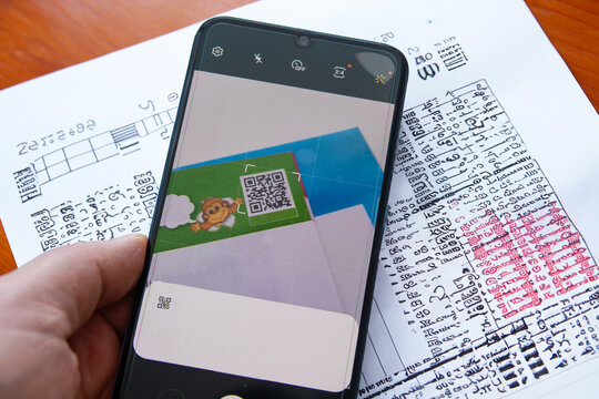 Mobile reading method with QR code in exam booklets. Concept photo on education.