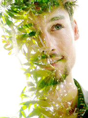 A double exposure portrait of a young man with a disappearing effect - 740501012