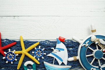 Nautical ornaments Antique sail boat Toy model and lifebuoy on wooden background