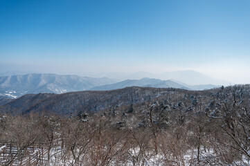 Early morning view of the mountains in the mist from the top of the mountain
