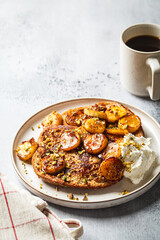 French toast with caramelized banana and pistachios.