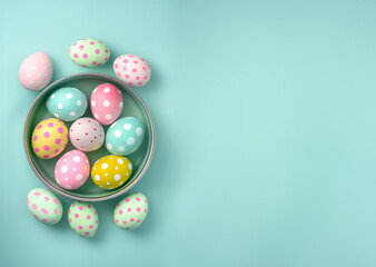 Pastel colourful hand painted easter eggs in a tin can on turquoise background. Banner wallpaper seamless frame. Flat lay